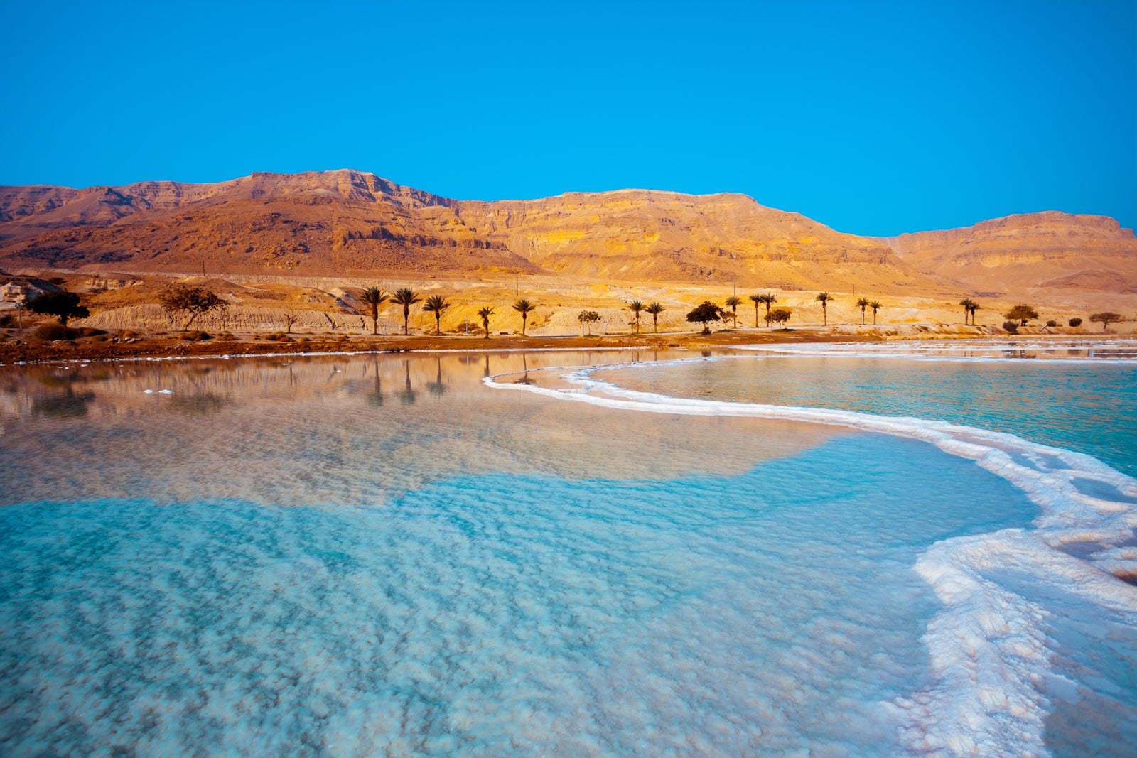 The dead sea with tall desert mountains in the background.